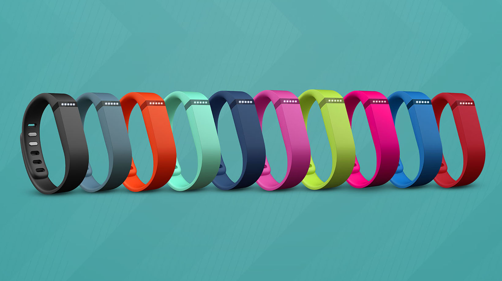 A line of colorful Fitbits or wearables.